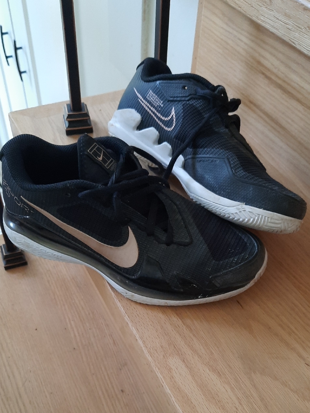 Nike Women’s Black Athletic Sneakers with Gold Swoosh Accent Size 6